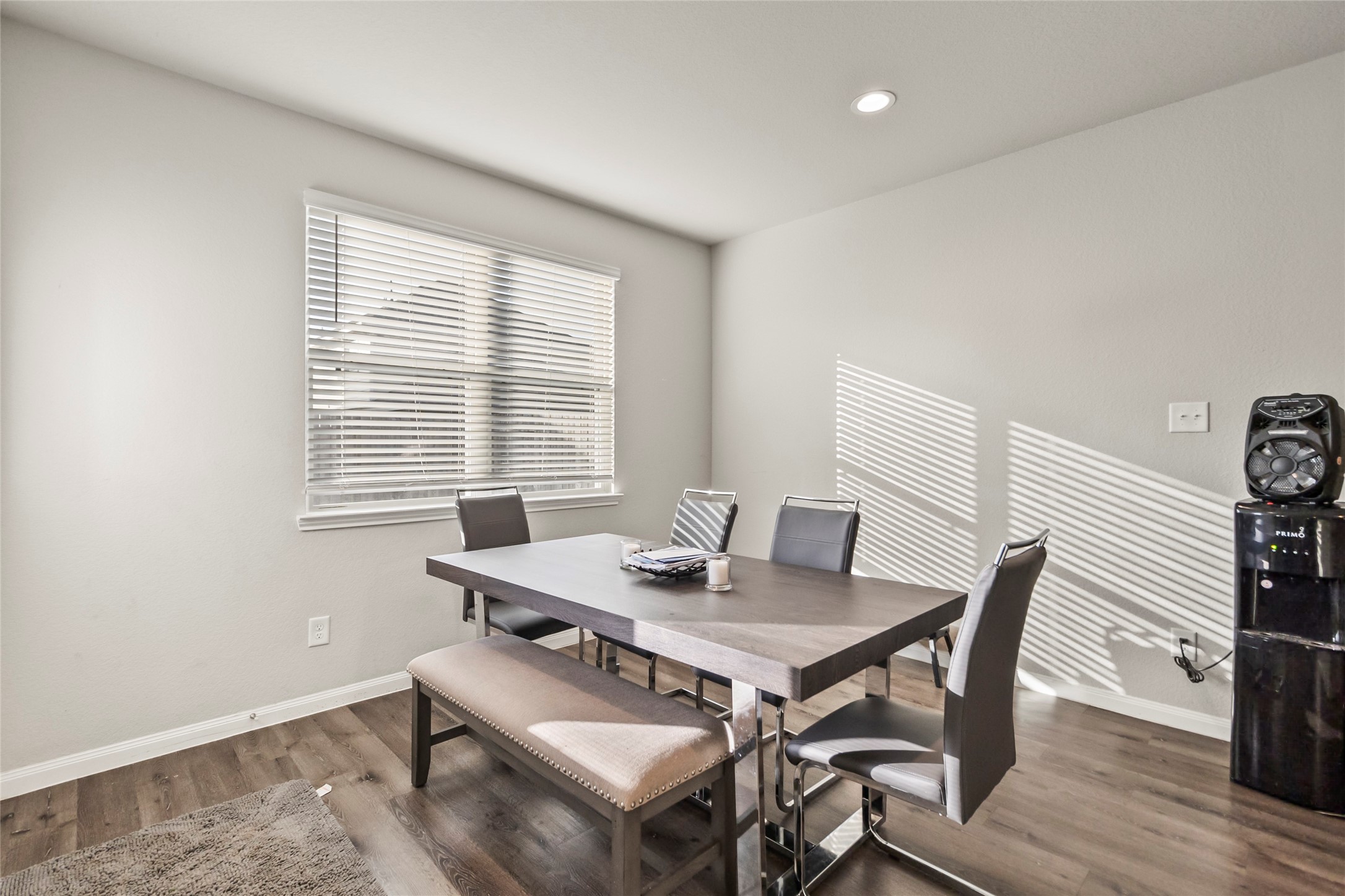 4831 Blue Jacaranda Way Spring, TX 77373 - Photo 6 of 24 a view of a dining room with furniture and wooden floor