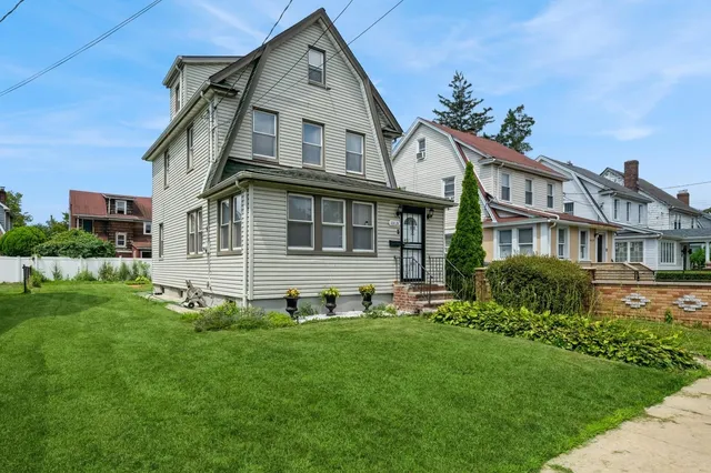 a front view of a house with a yard