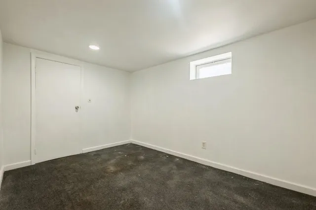 an empty room with a empty space and window
