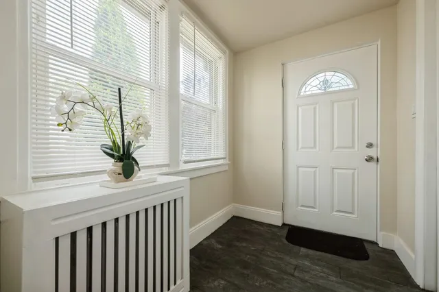 a view of entryway with wooden floor