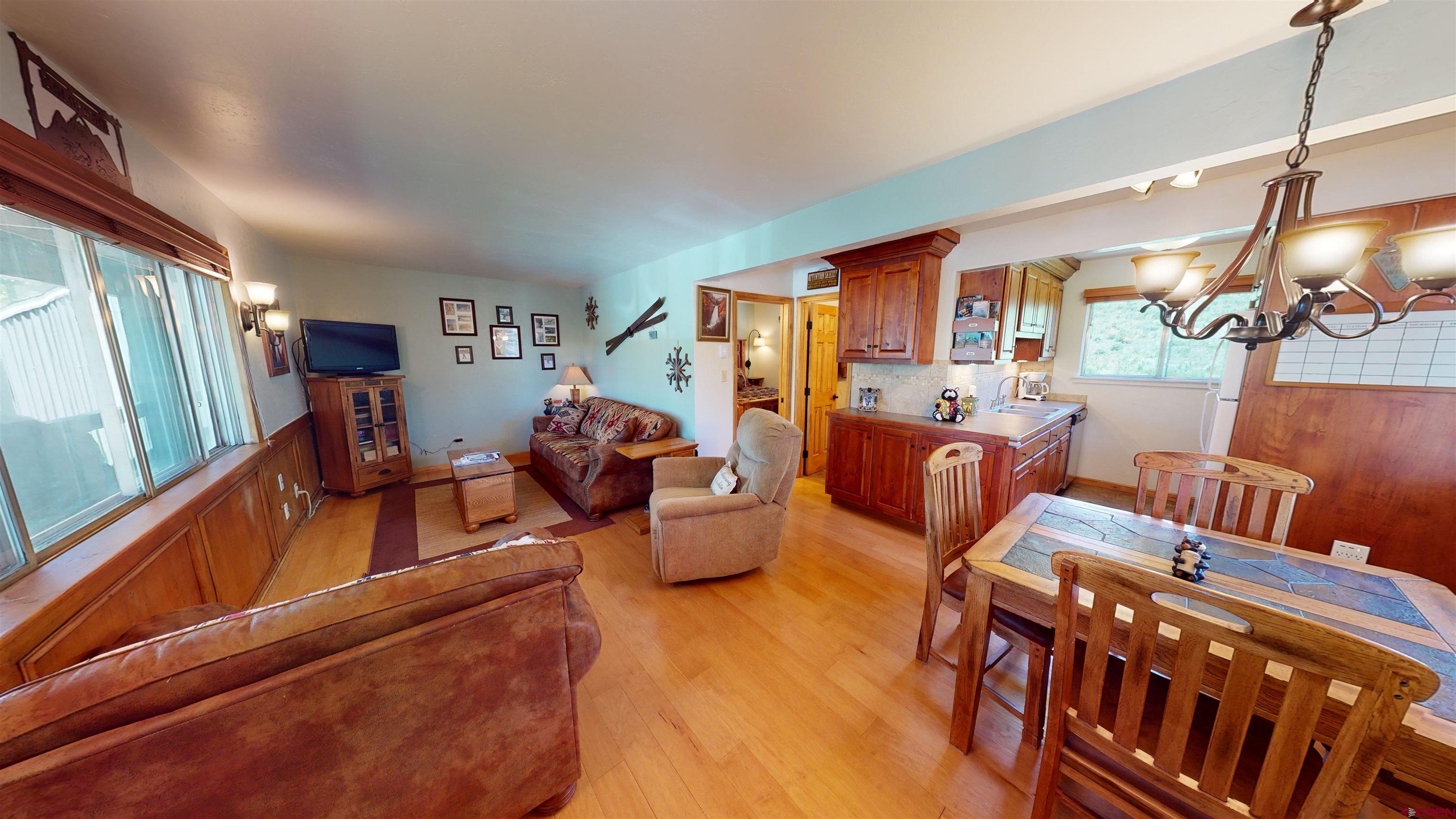 18 Crystal Road, Unit 3B Crested Butte, CO 81225 - Photo 7 of 20 a living room with furniture and a large window