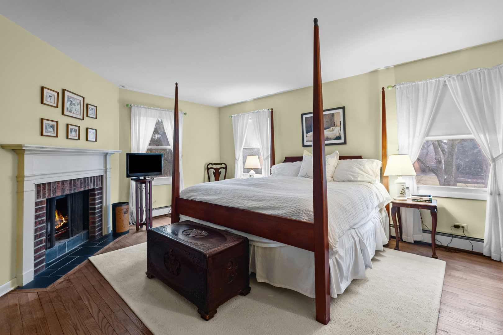 595 Washington Road Lake Forest, IL 60045 - Photo 17 of 28 a bed room with a bed and a fireplace