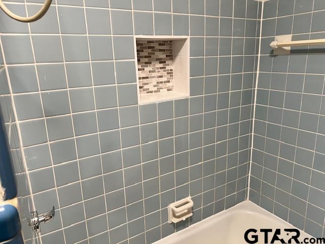 1114 West Camellia Street Tyler, TX 75701 - Photo 5 of 6 a bathroom with a shower