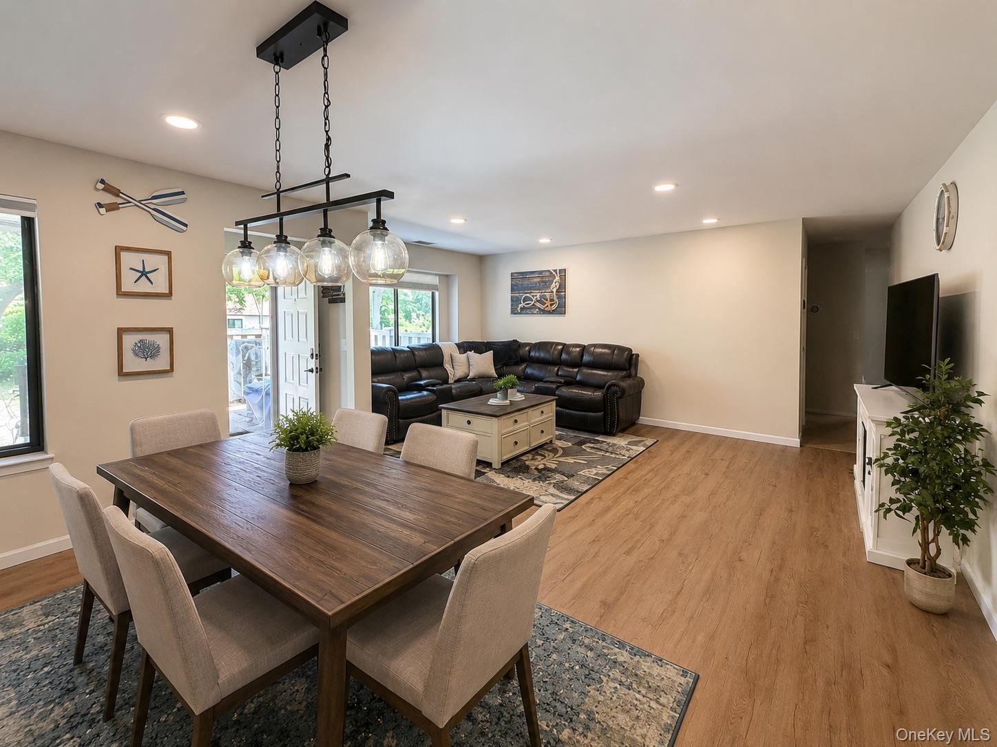 201 Birchwood Road, Unit 201 Coram, NY 11727 - Photo 9 of 27 a view of a dining room with furniture window and wooden floor