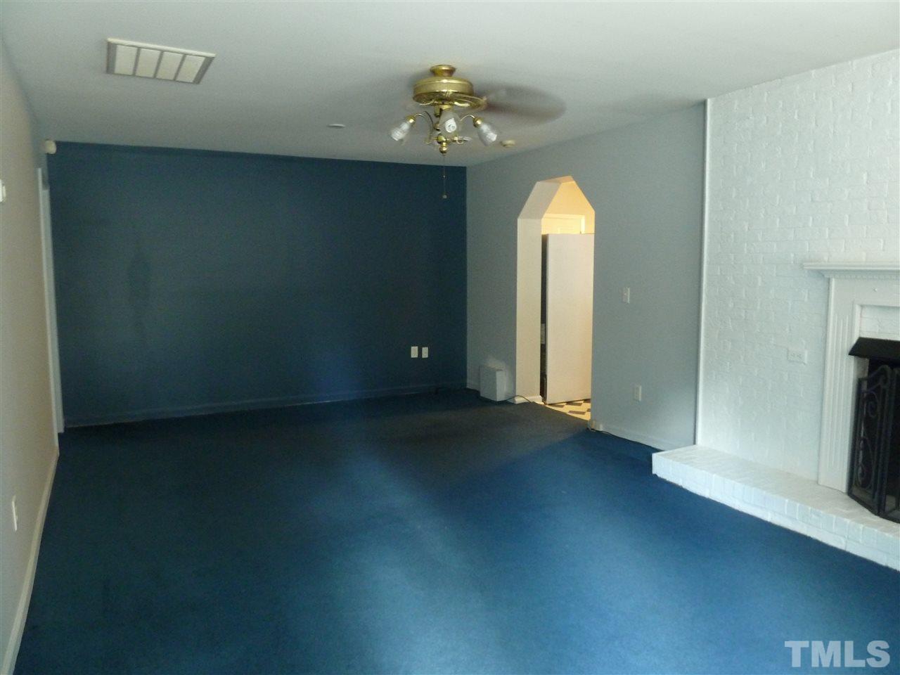 1122 Arvin Road Durham, NC 27704 - Photo 7 of 9 a view of a livingroom with a fireplace