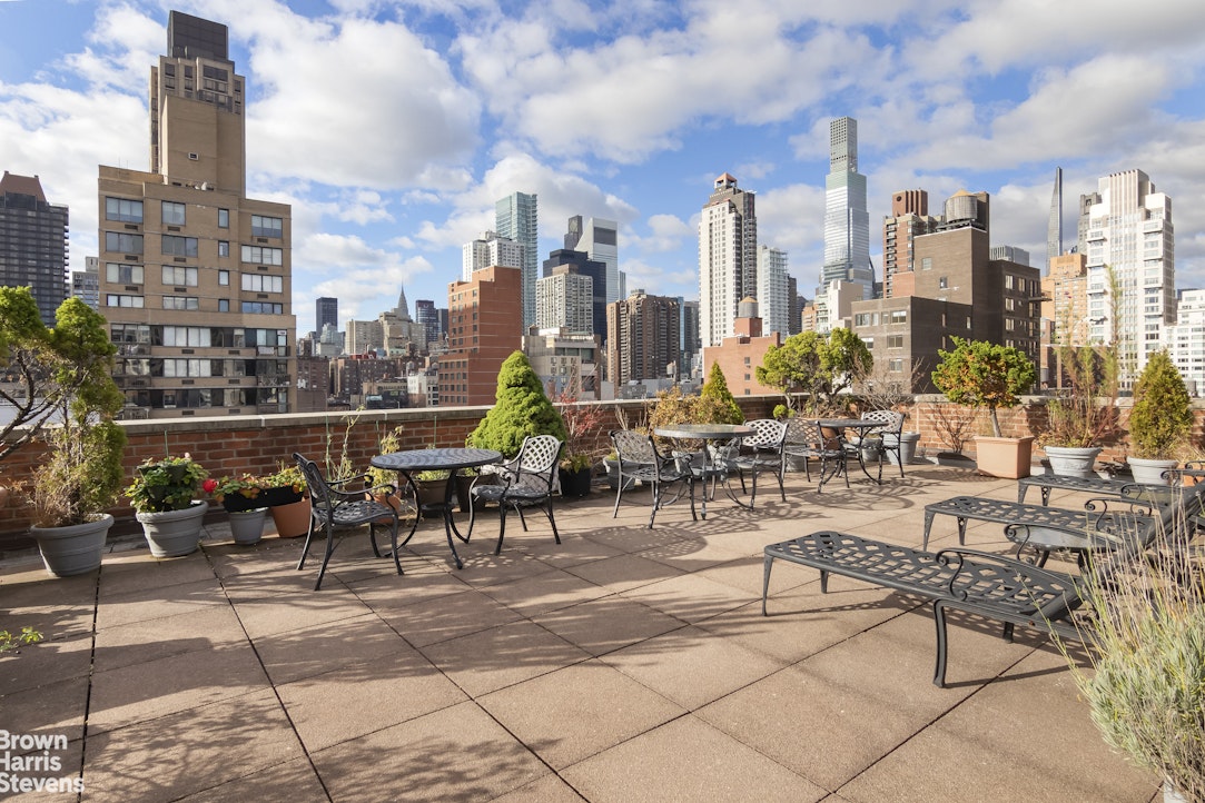 405 East 63rd Street, Unit 10H Manhattan, NY 10065 - Photo 5 of 9 a view of a city with sitting area
