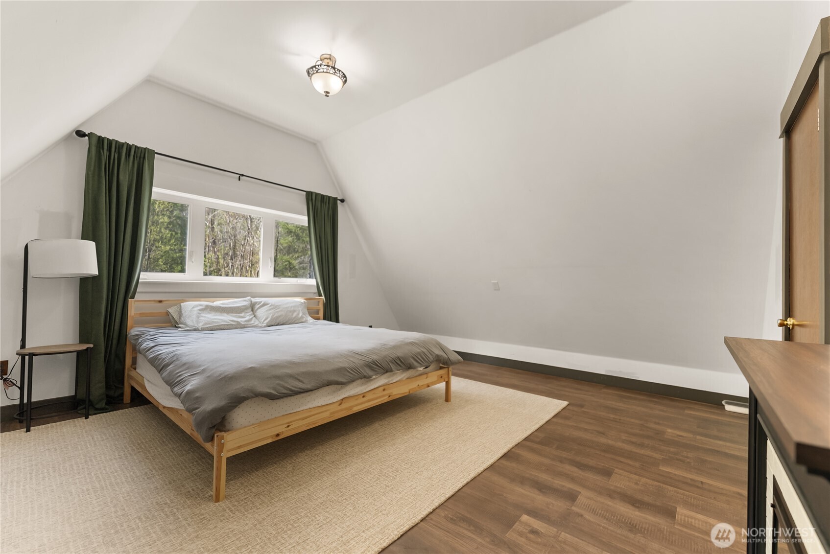 211 West Buttermilk Creek Road Twisp, WA 98856 - Photo 11 of 40 a bedroom with a bed and window