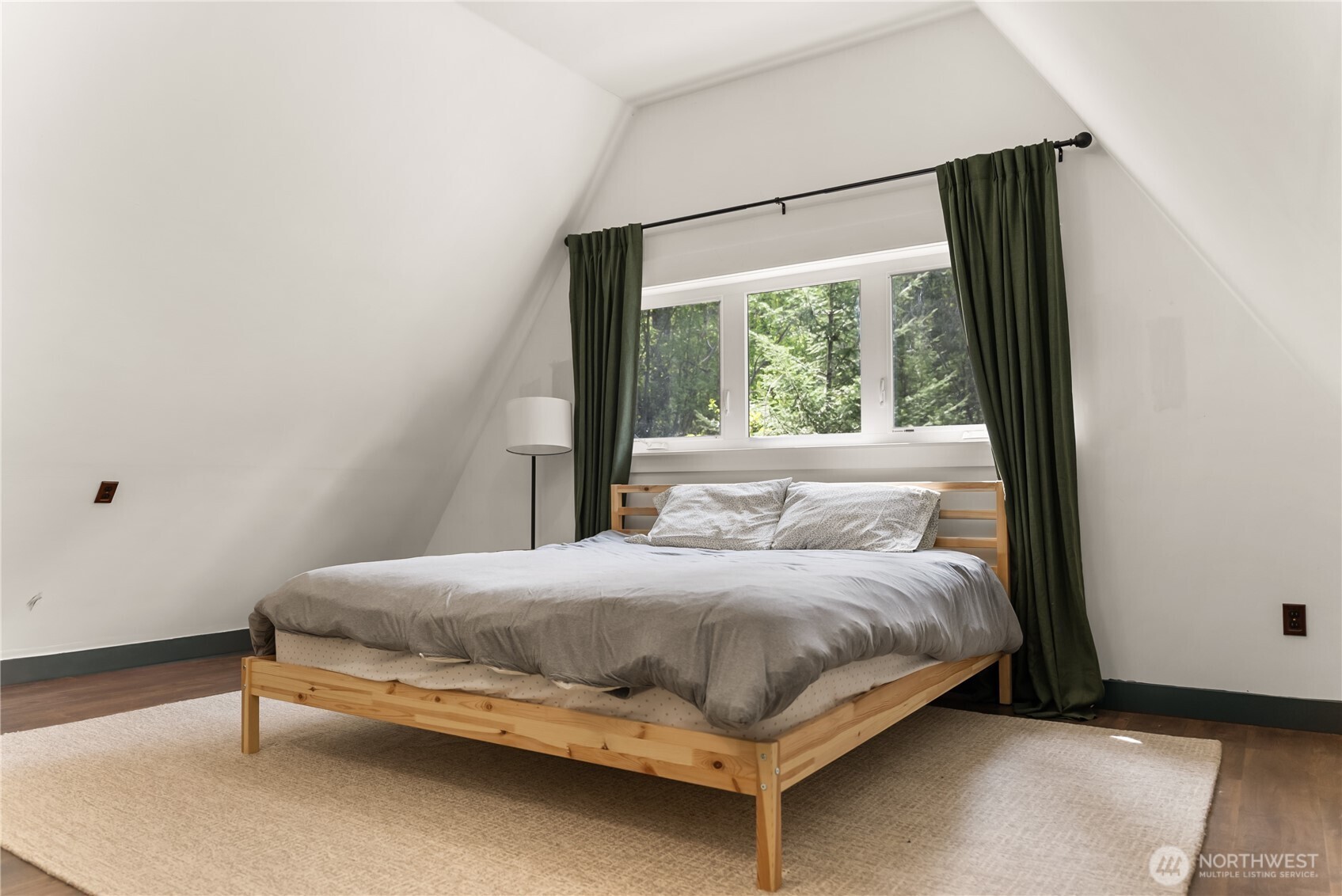 211 West Buttermilk Creek Road Twisp, WA 98856 - Photo 12 of 40 a bedroom with a bed and window