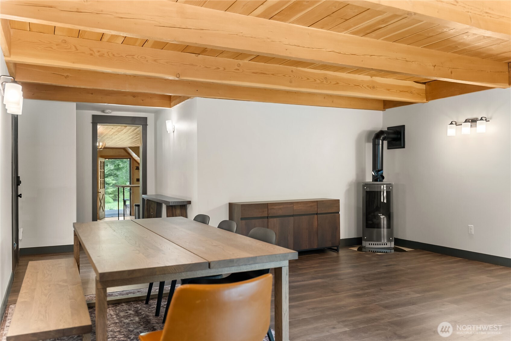 211 West Buttermilk Creek Road Twisp, WA 98856 - Photo 16 of 40 a view of a dining room with furniture and wooden floor