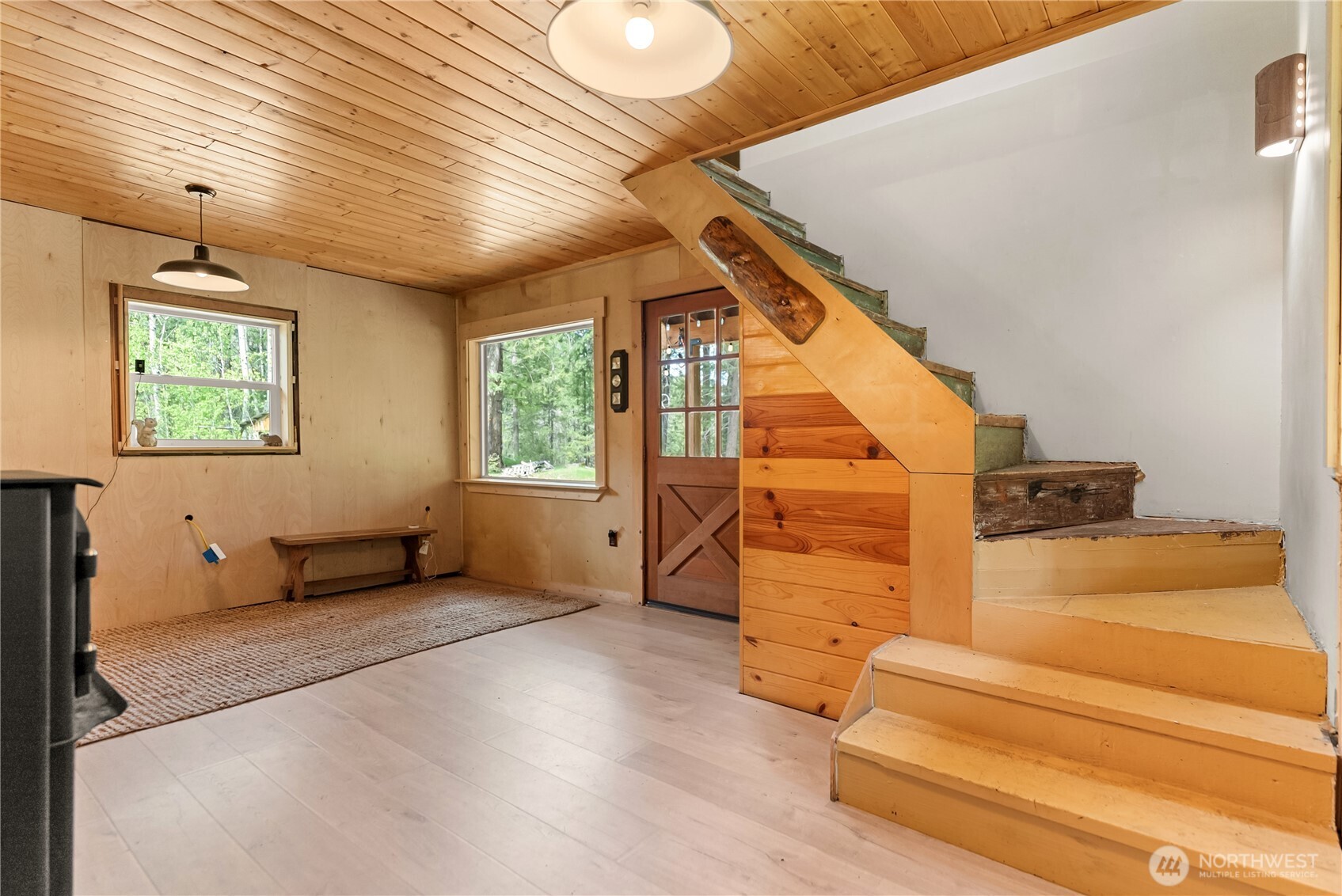 211 West Buttermilk Creek Road Twisp, WA 98856 - Photo 26 of 40 a view of an empty room with wooden floor and a window
