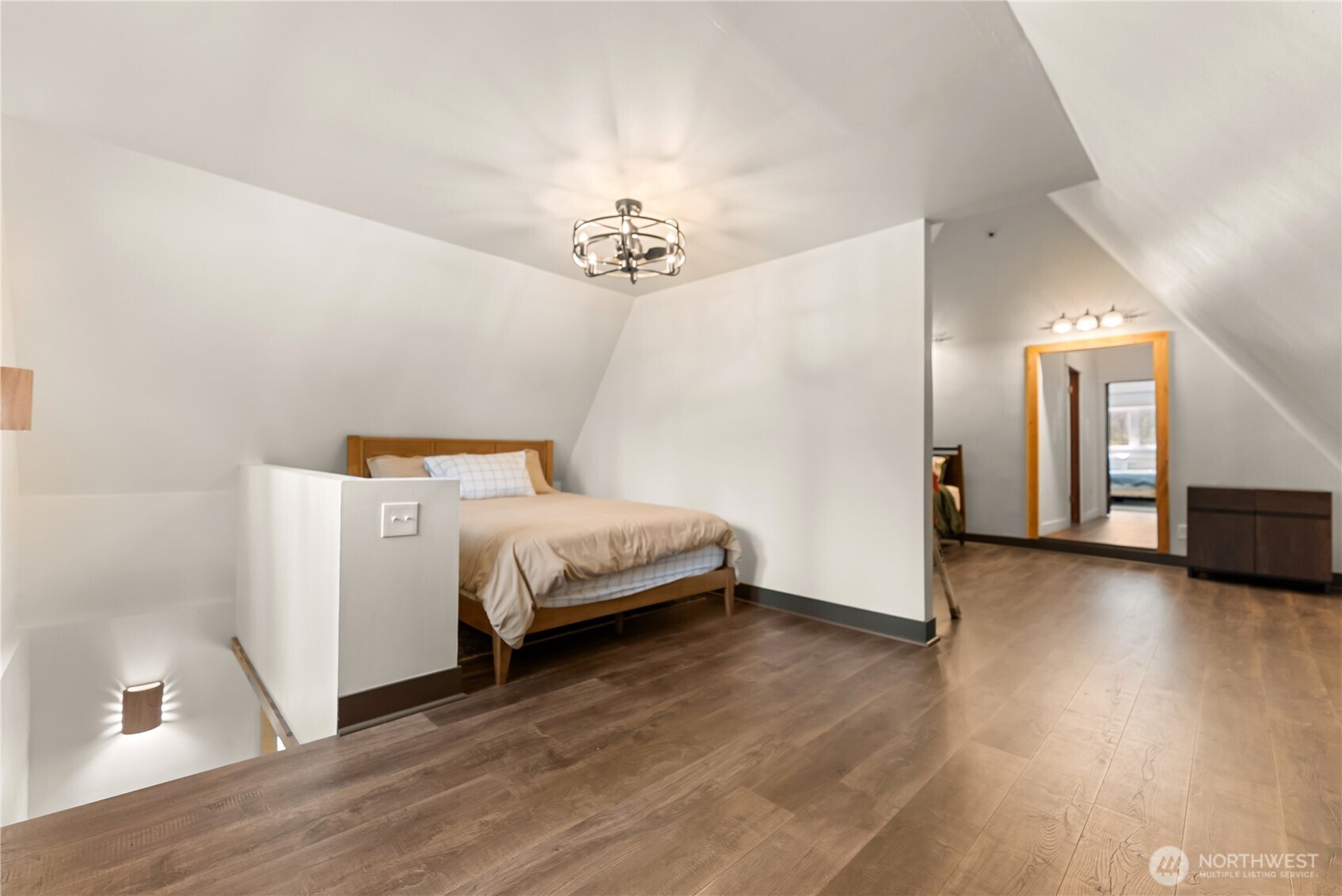 211 West Buttermilk Creek Road Twisp, WA 98856 - Photo 28 of 40 a bedroom with a bed and wooden floor