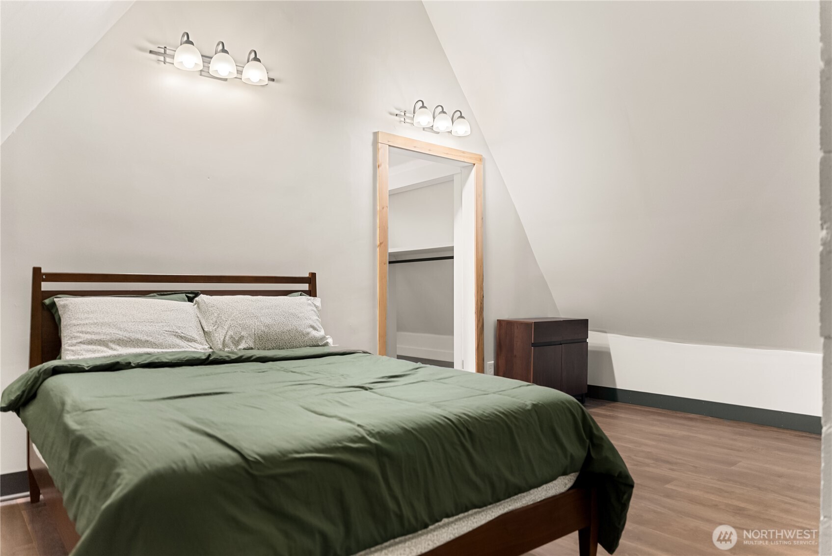211 West Buttermilk Creek Road Twisp, WA 98856 - Photo 31 of 40 a bedroom with a bed and a chandelier