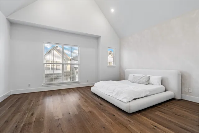 a living room with a bed furniture and a window