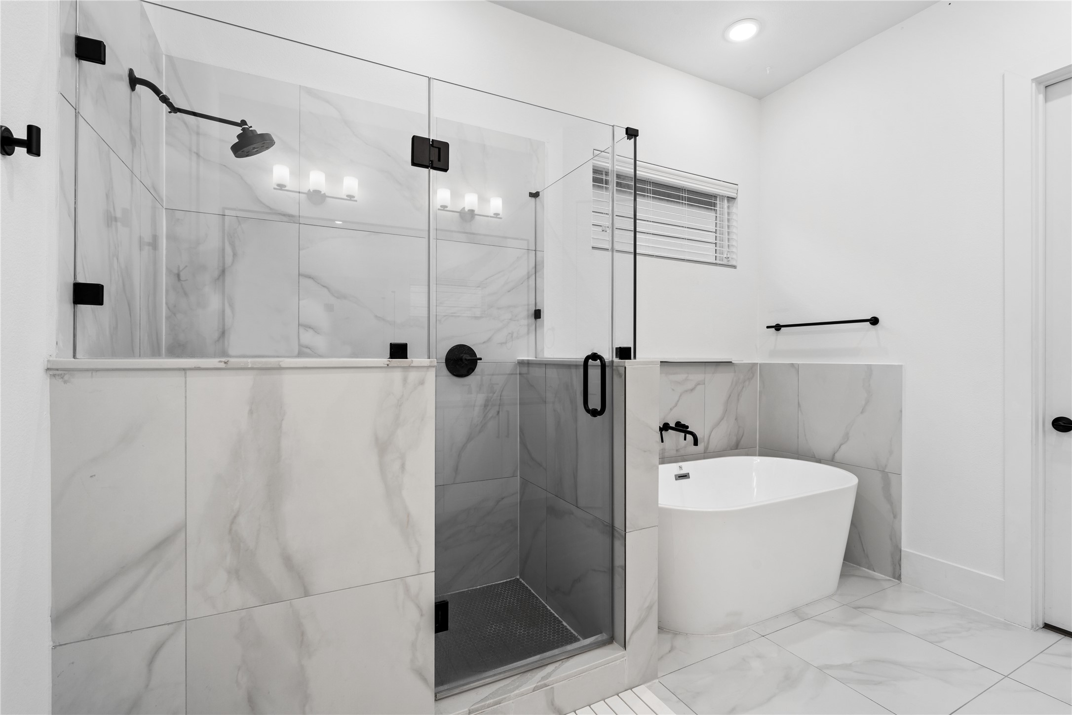 9011 Wellspring Drive Houston, TX 77080 - Photo 18 of 24 a bathroom with a bathtub and shower