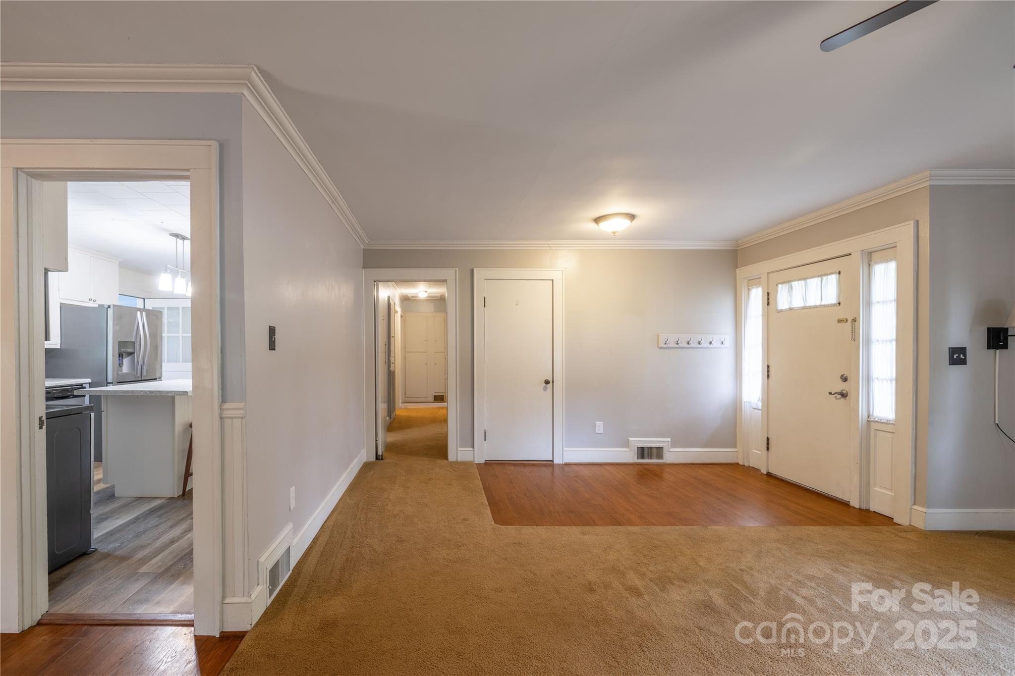 80 Pine Street Badin, NC 28009 - Photo 11 of 42 a view of a livingroom with wooden floor and kitchen space