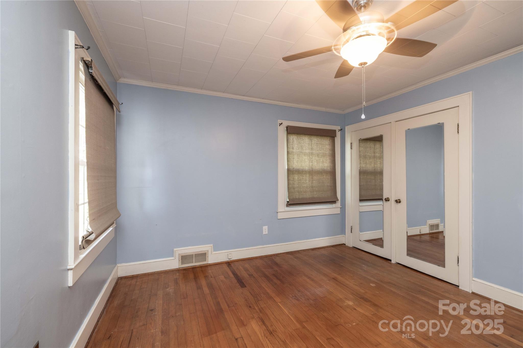80 Pine Street Badin, NC 28009 - Photo 18 of 42 wooden floor in an empty room with a window