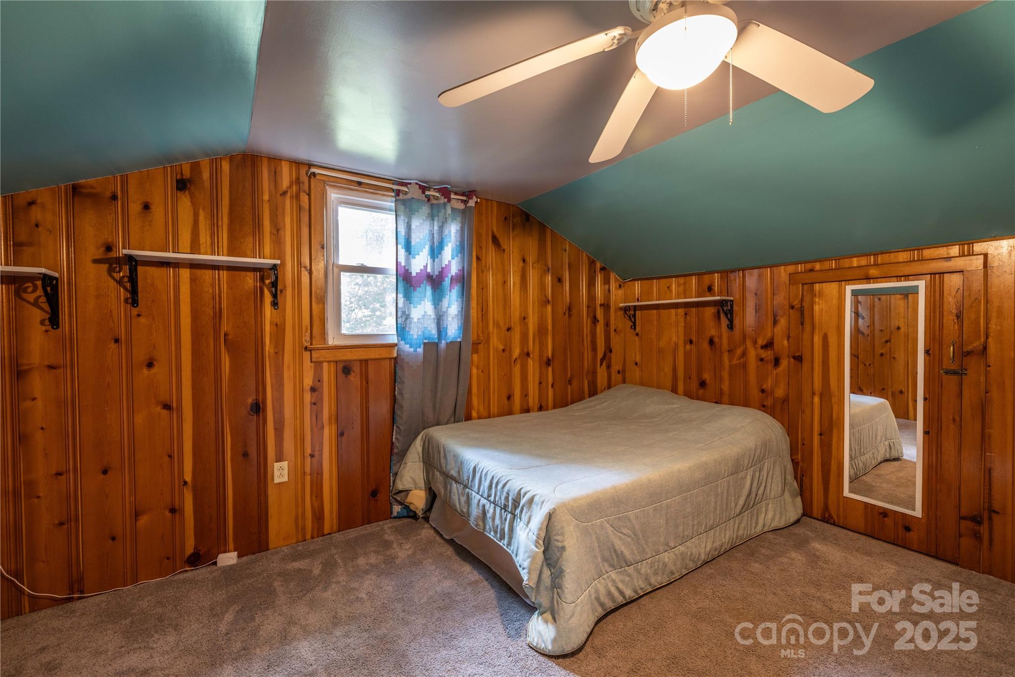 80 Pine Street Badin, NC 28009 - Photo 26 of 42 a bed sitting in a room next to a window
