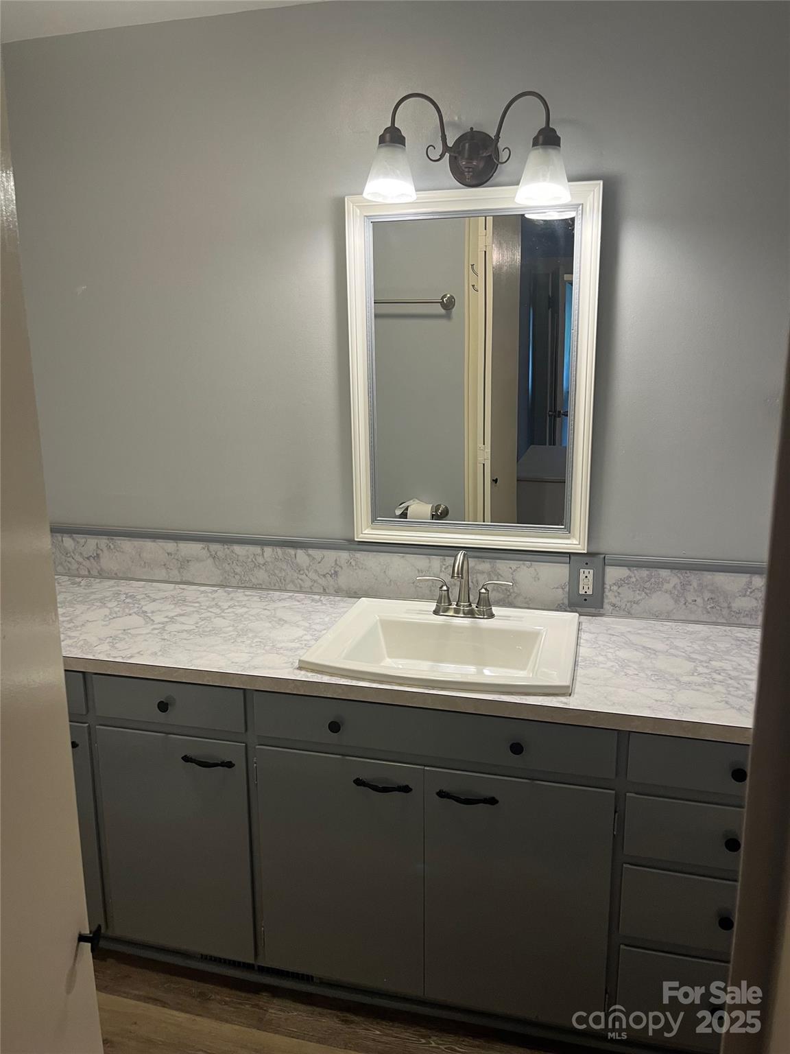80 Pine Street Badin, NC 28009 - Photo 32 of 42 a bathroom with a granite countertop sink and a mirror