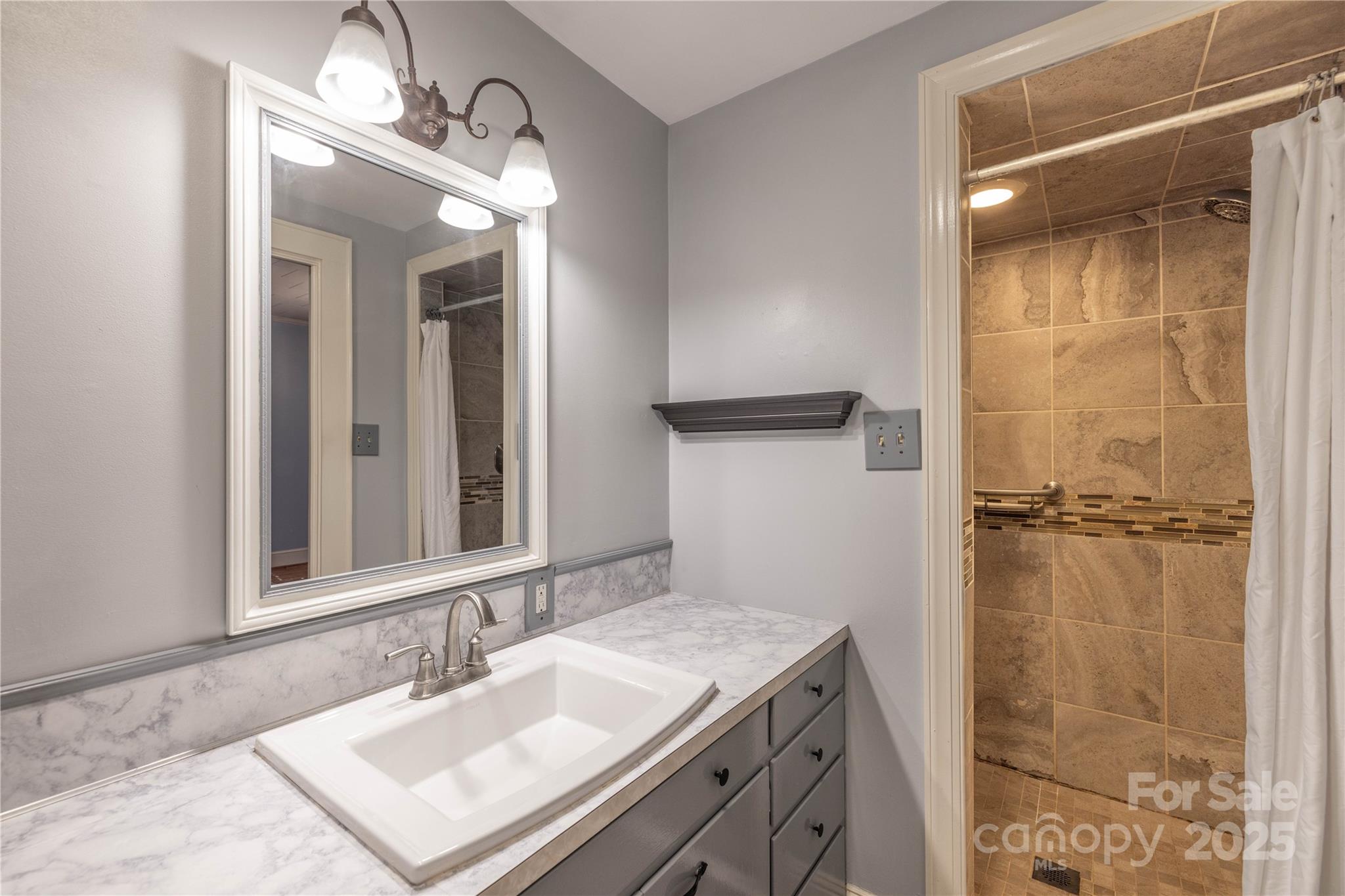 80 Pine Street Badin, NC 28009 - Photo 33 of 42 a bathroom with a sink vanity granite and a mirror