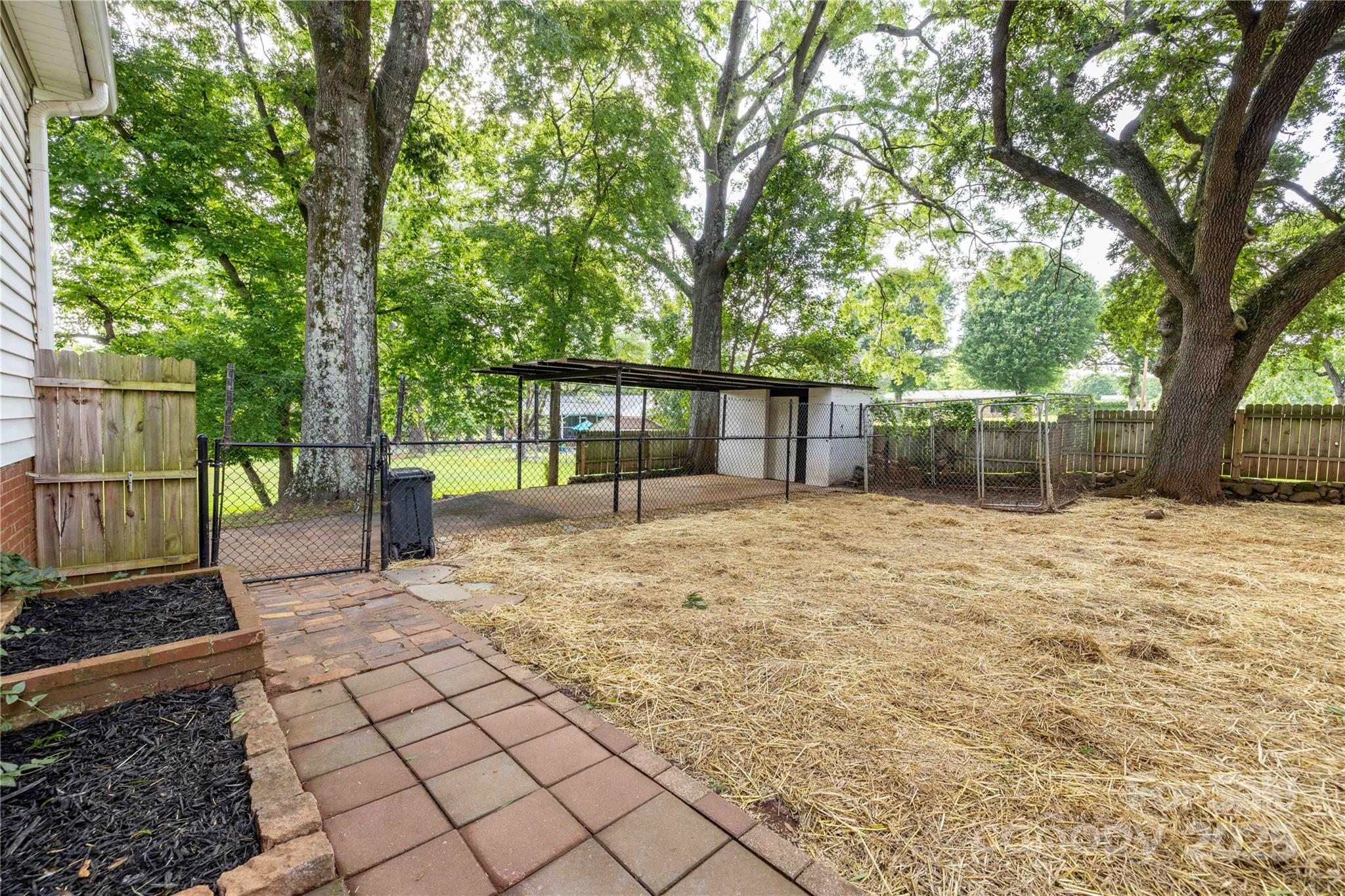 80 Pine Street Badin, NC 28009 - Photo 37 of 42 a view of a backyard with a large tree