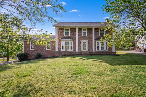 a view of a house with a garden