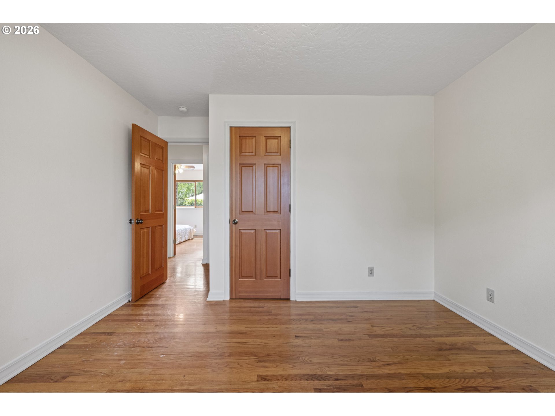 84 Green Lane Eugene, OR 97404 - Photo 29 of 41 a view of an empty room with wooden floor