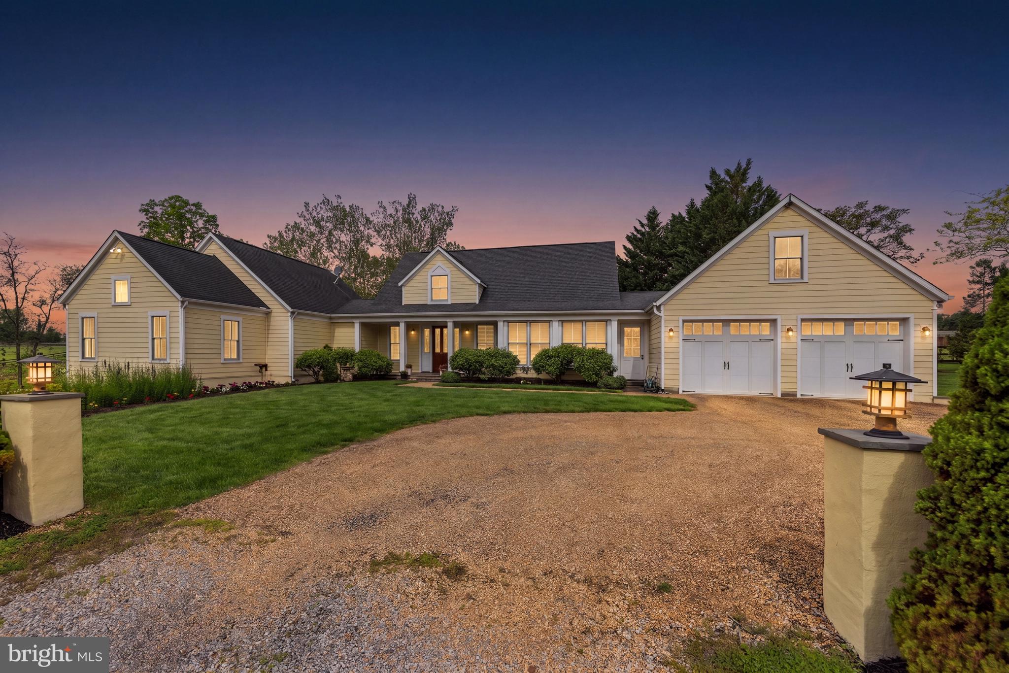20147 Woodtrail Road Round Hill, VA 20141 - Photo 41 of 41 a front view of a house with a yard and garage