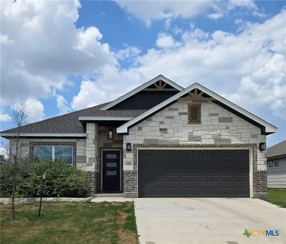 a view of house with garden
