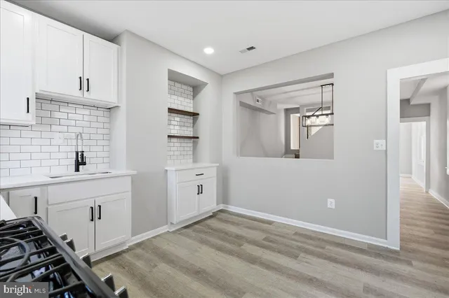 a view of a kitchen with electric appliances
