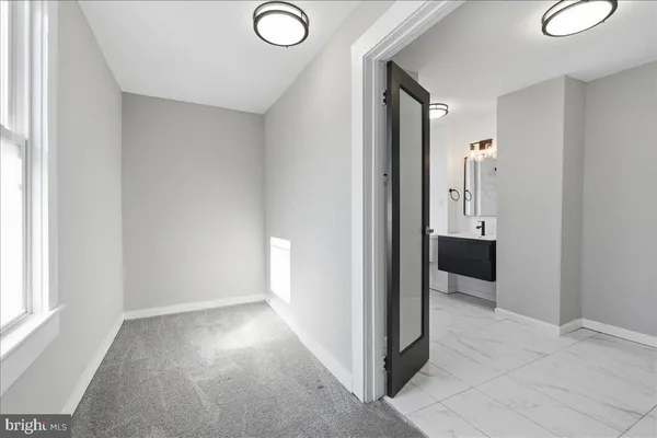 a view of a hallway with closet area
