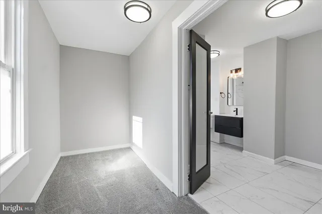 a view of a hallway with closet area