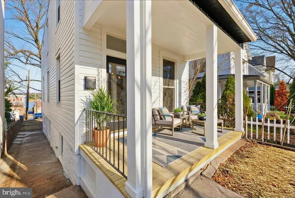 a view of a living room and a balcony