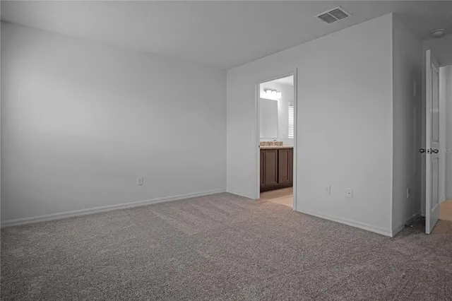 an empty room with an entrance and door