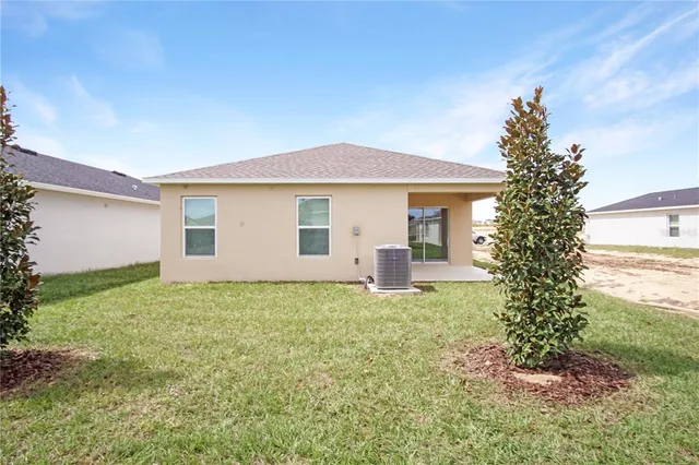 a house view with a backyard space