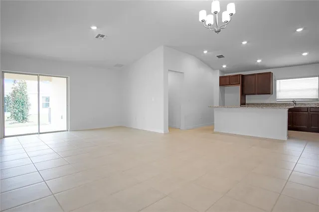 a view of a kitchen with a sink and microwave