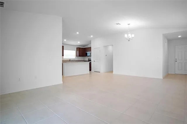 a view of a kitchen with a sink and cabinets