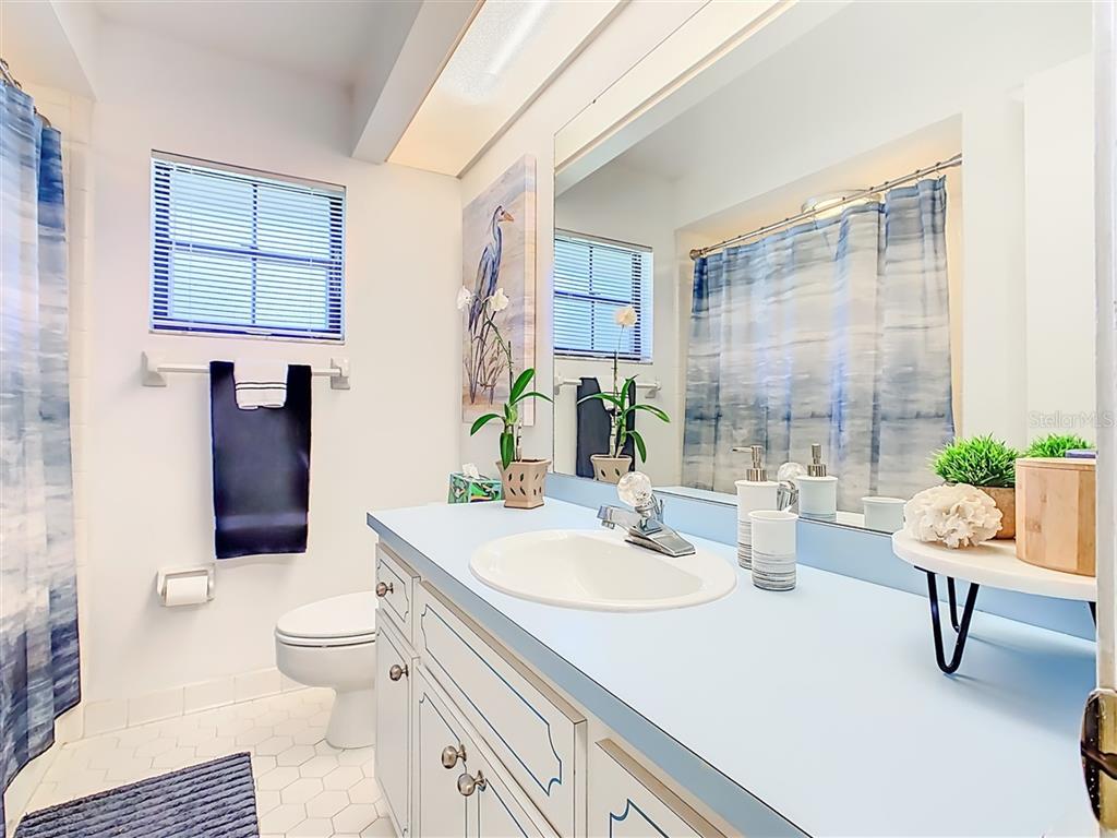 2901 Plantation Road Winter Haven, FL 33884 - Photo 22 of 30 a bathroom with a sink toilet and shower