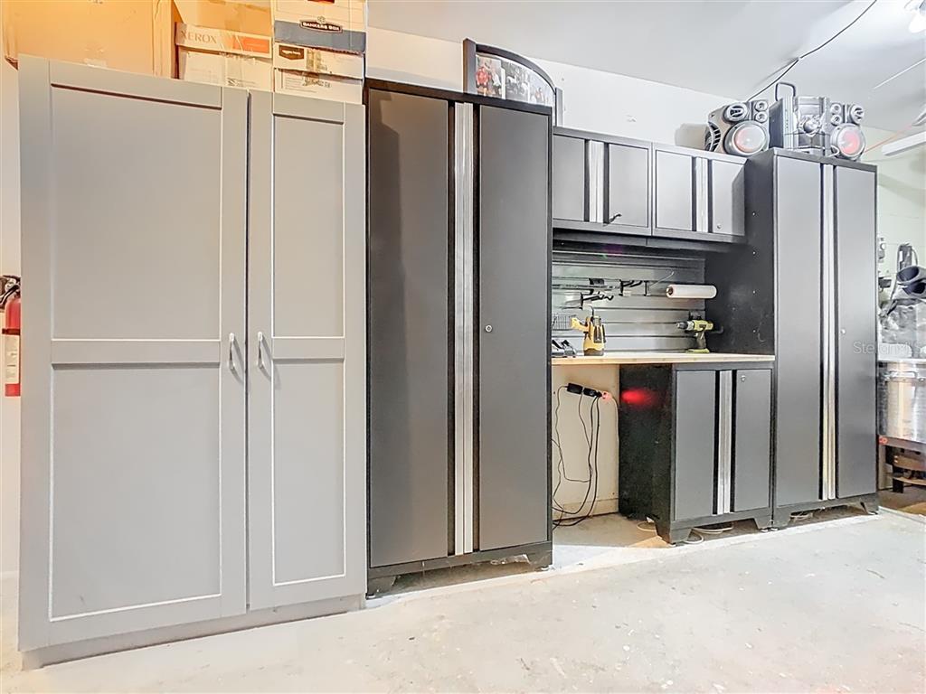 2901 Plantation Road Winter Haven, FL 33884 - Photo 25 of 30 a view of a kitchen with refrigerator and cabinets