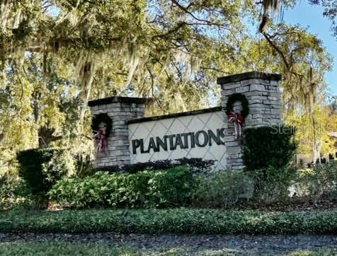 2901 Plantation Road Winter Haven, FL 33884 - Photo 30 of 30 a sign that is sitting on a brick wall