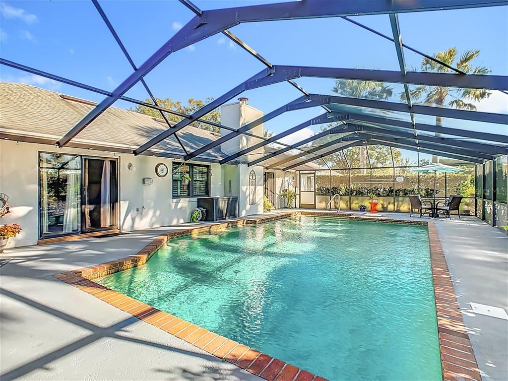 2901 Plantation Road Winter Haven, FL 33884 - Photo 3 of 30 a view of a swimming pool with a patio