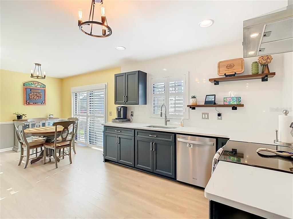 2901 Plantation Road Winter Haven, FL 33884 - Photo 10 of 30 a kitchen with a sink cabinets and window