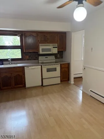 a kitchen with stainless steel appliances granite countertop a stove and a sink