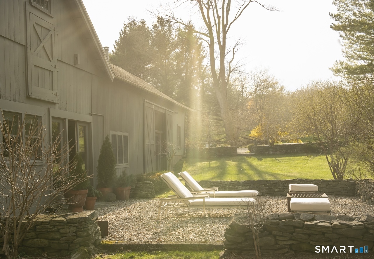 197 Taconic Road Salisbury, CT 06068 - Photo 1 of 1 a view of a swimming pool with an outdoor seating
