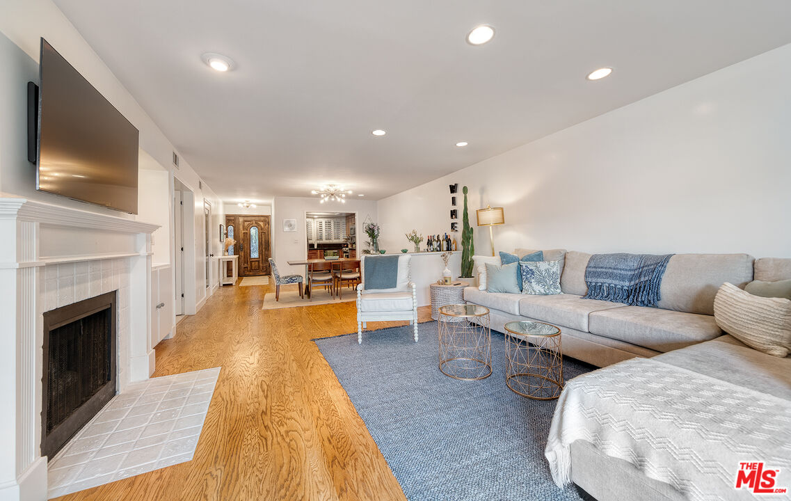 4350 Vía Dolce, Unit 105 Marina del Rey, CA 90292 - Photo 11 of 31 a living room with furniture and a fireplace