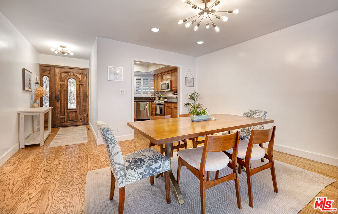 4350 Vía Dolce, Unit 105 Marina del Rey, CA 90292 - Photo 12 of 31 a dining room with furniture and wooden floor