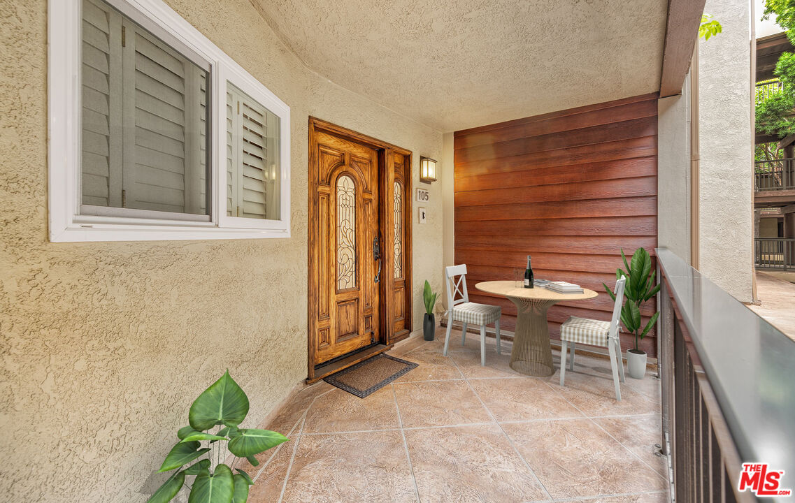 4350 Vía Dolce, Unit 105 Marina del Rey, CA 90292 - Photo 19 of 31 a backyard of a house with outdoor seating