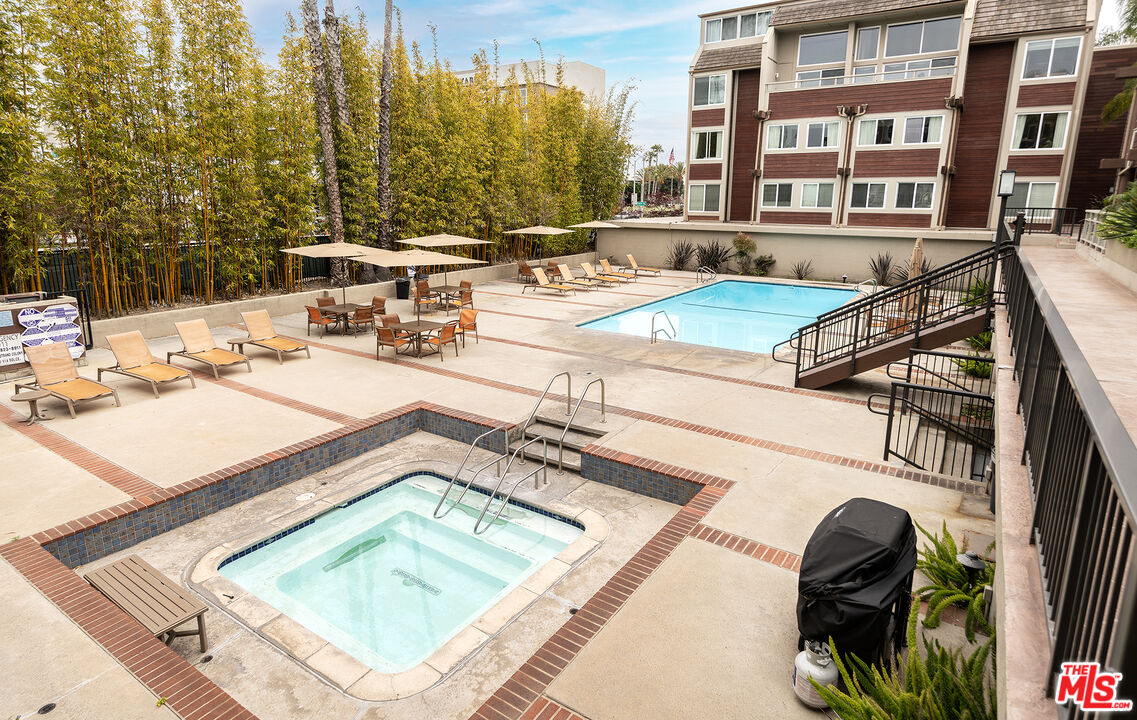 4350 Vía Dolce, Unit 105 Marina del Rey, CA 90292 - Photo 20 of 31 a view of a patio with swimming pool