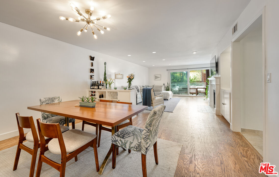 4350 Vía Dolce, Unit 105 Marina del Rey, CA 90292 - Photo 2 of 31 a view of a dining room with furniture and wooden floor