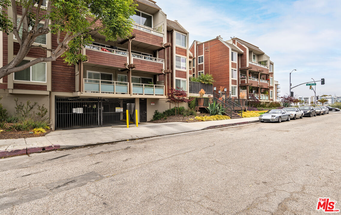 4350 Vía Dolce, Unit 105 Marina del Rey, CA 90292 - Photo 24 of 31 a view of a street with a building in the background