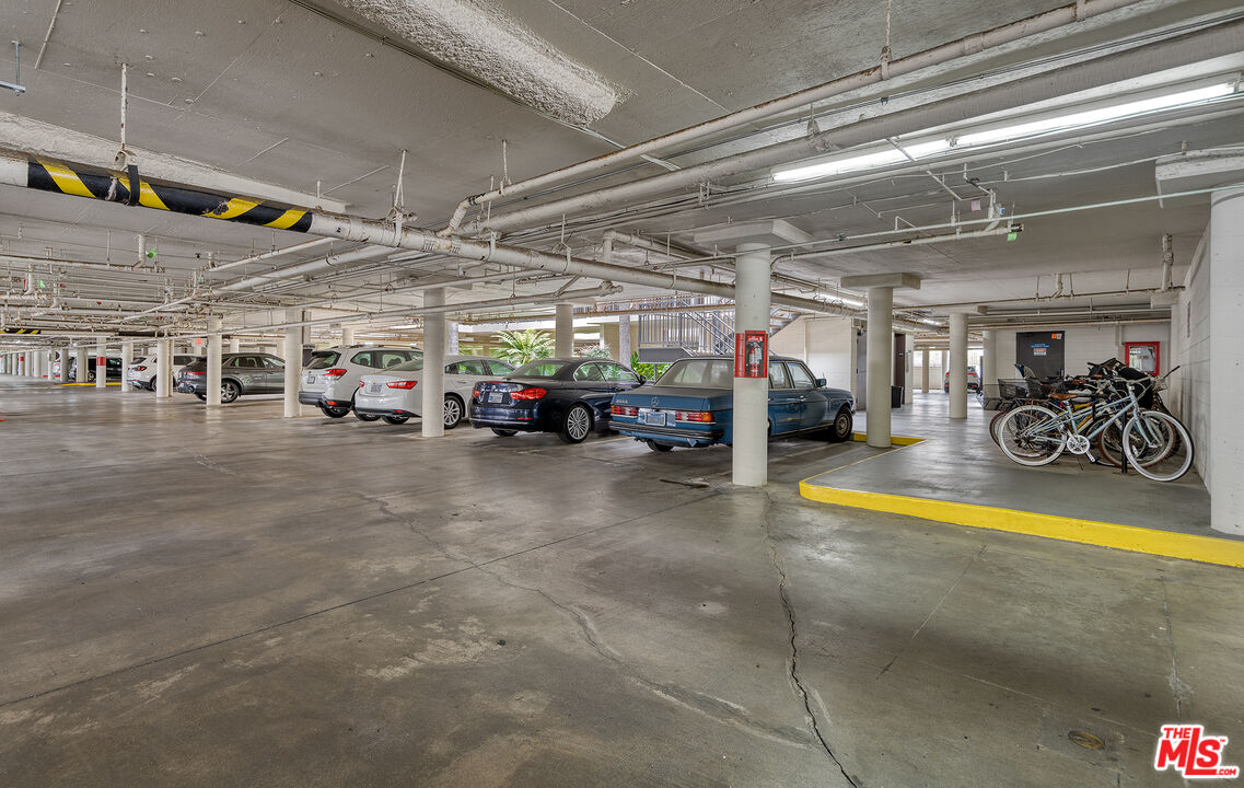 4350 Vía Dolce, Unit 105 Marina del Rey, CA 90292 - Photo 25 of 31 a view of parking garage with cars